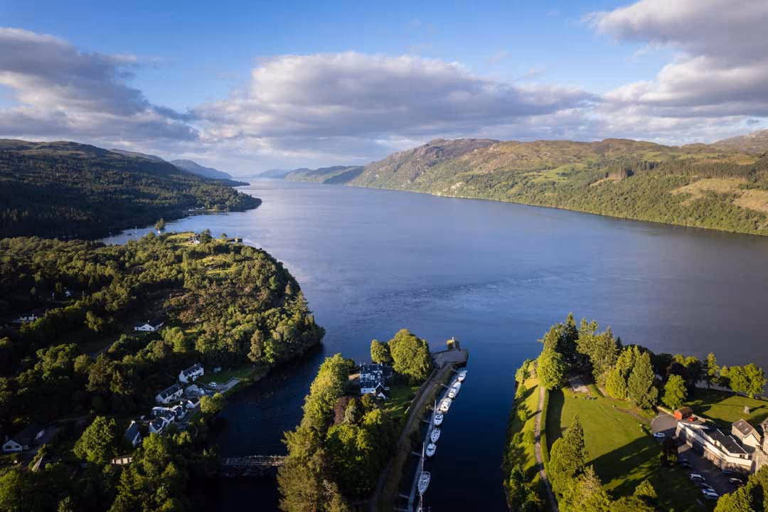 Loch Ness from above Fort Augustus, the canal basin and moorings in the foreground and the loch running twenty-three miles north between the hills