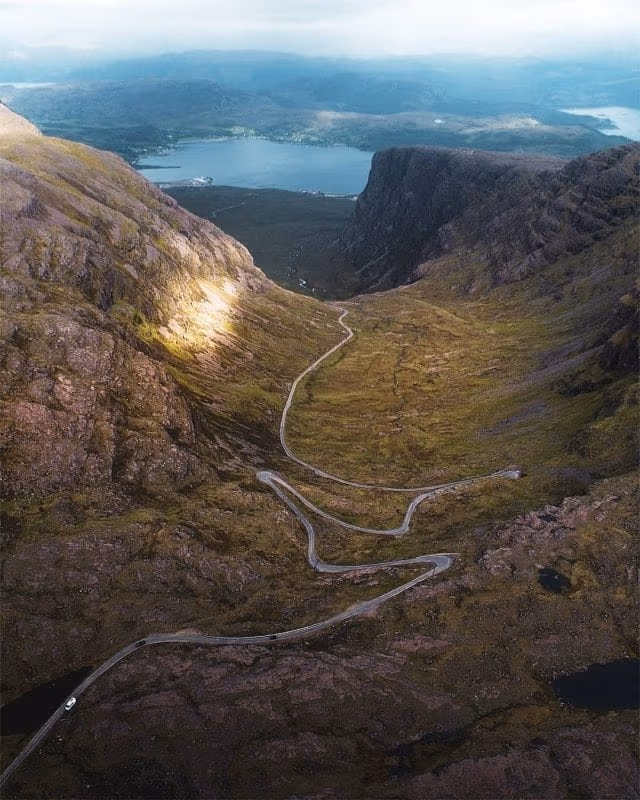The hairpins of the Bealach na Bà seen from above, the road switching back on itself up the head of the corrie